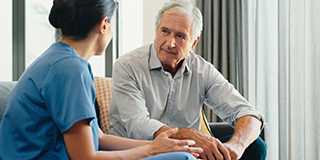 A female nurse with elderly male patient